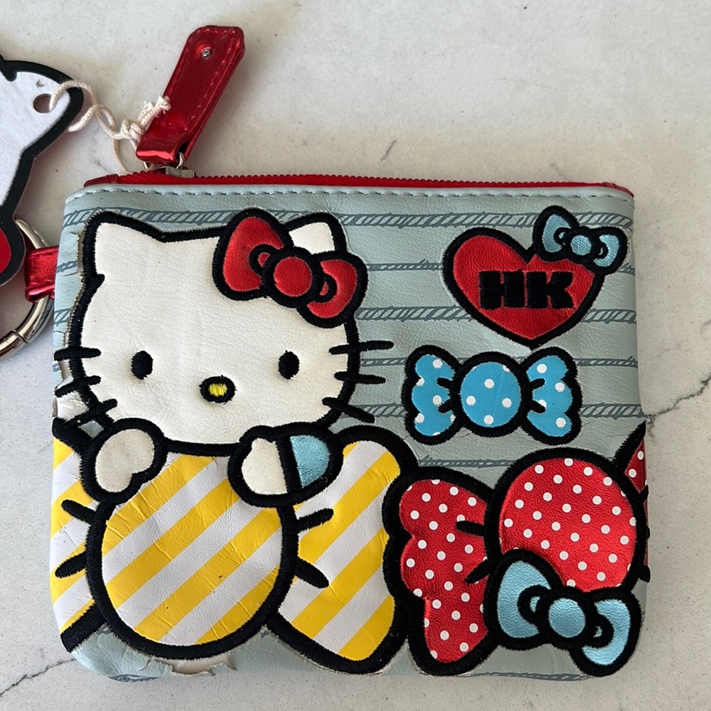 Brand new never worn with tags. Hello kitty coin purse.